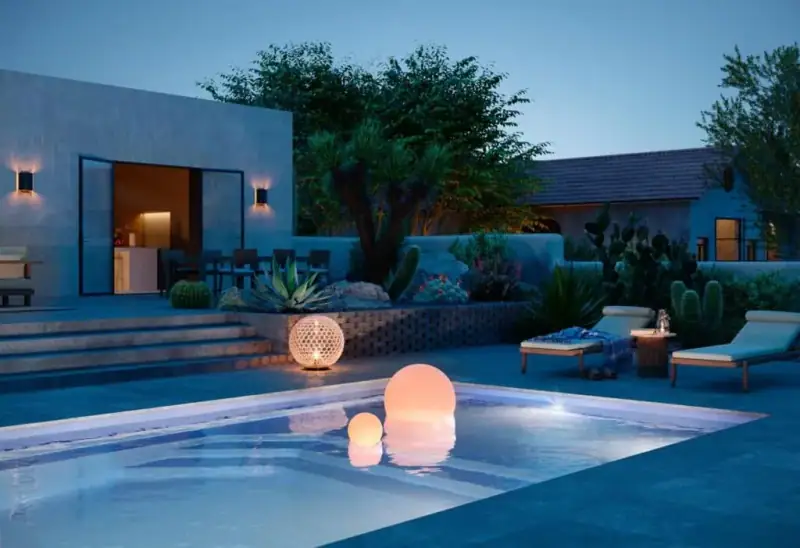 Latham Apollo 14 fiberglass pool with tanning ledge lifestyle view